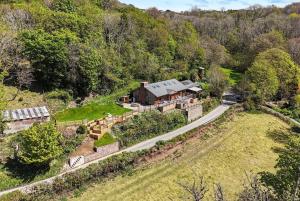 an aerial view of a house on a hill at Luxury secluded coastal retreat - With hot tub in Ilfracombe