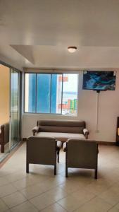 TV a/nebo společenská místnost v ubytování Suite frente al mar Atacames + 8 fotografií
