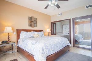 a bedroom with a bed and a ceiling fan at Sonoran Sky in Puerto Peñasco