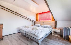 a bed in a small room with a window at Cozy Apartment In Smarje With House Sea View in Šmarje