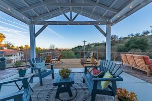 a patio with blue chairs and a table at Bella Vita in Paso Robles