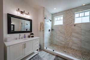 a bathroom with a shower and a sink and a mirror at Bella Vita in Paso Robles +50 photos