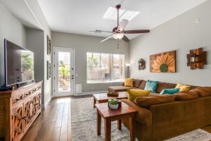 a living room with a couch and a flat screen tv at Harrison Chandler in Chandler