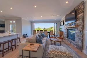 a living room with a couch and a fireplace at Bella Vita in Paso Robles