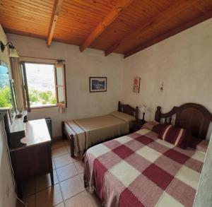Ένα ή περισσότερα κρεβάτια σε δωμάτιο στο Casas de la Loma +4 φωτογραφίες