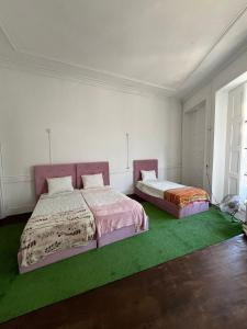 Ένα ή περισσότερα κρεβάτια σε δωμάτιο στο Casa Augusta 2