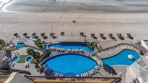 an overhead view of a swimming pool and the beach at Sonoran Sky in Puerto Peñasco