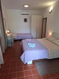 Postel nebo postele na pokoji v ubytování Apartments with parking spaces Punta kriza, Cres - 867