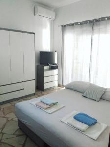 Postel nebo postele na pokoji v ubytování Apartments and rooms by the sea Podaca, Makarska - 16160