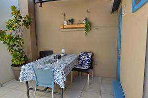 a table and chairs in a room with a table at Apartments by the sea Veli Losinj, Losinj - 19196 in Veli Lošinj +11 photos