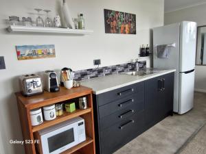 Kuchyň nebo kuchyňský kout v ubytování Makuri Bay Hideaway