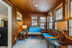 a living room with a bench and a table at Hickman street 208a in Rehoboth Beach