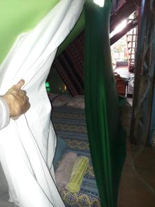 a person sticking their hand out from under a tent at Castelo de pedras no Vale da Lua in Alto Paraíso de Goiás +14 photos
