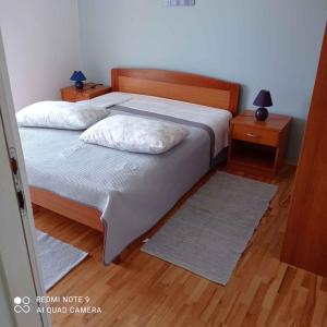 Ein Bett oder Betten in einem Zimmer der Unterkunft Apartment Barbat 22