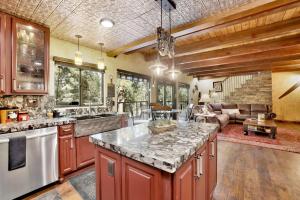 a kitchen with a large island in a room at How sweet it is #1531 in Big Bear Lake +14 photos