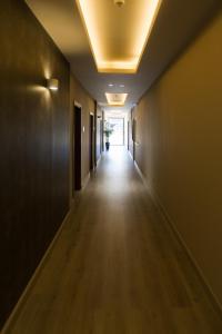 a hallway with a door leading to a hallway at Manolia City Residences in Nicosia