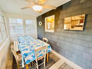 a dining room with a table and a ceiling fan at Oak avenue 49 in Rehoboth Beach