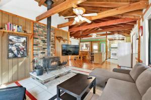 a living room with a couch and a fireplace at Moonlight ridge - 1929 in Big Bear Lake