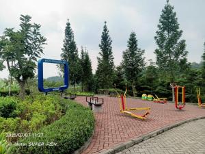 a playground with benches and a mirror in a park at Penginapan, homestay Gor Ken Arok kota malang jawa timur bisa 5-10 orang cocok bagi yg mau ke Bromo dan sekitarnya in Bareng