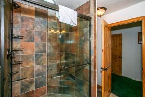 a shower with a glass door in a bathroom at Pleasant Pause#1864 in Fawnskin +20 photos