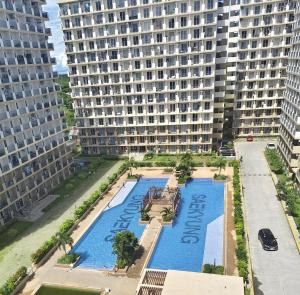 an aerial view of a large building with a swimming pool at B Studio in Basbas