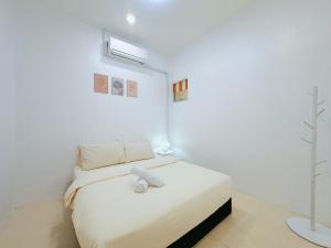 Postel nebo postele na pokoji v ubytování BM Alma AutoCity Aeonjusco