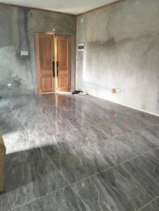 an empty room with a concrete floor and a door at House in Chocolate Hills carmen Bohol in Carmen