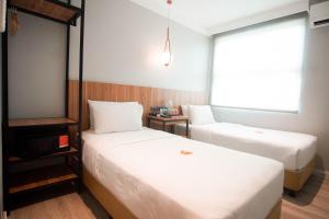 Postel nebo postele na pokoji v ubytování Go Hotels Bacolod + 11 fotografií