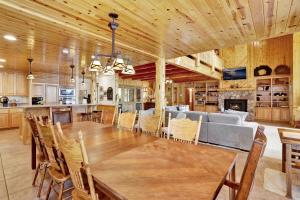 a dining room and kitchen with a table and a couch at Eagle point lake house #2471 in Big Bear Lake