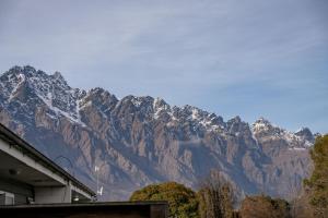 a view of a snow covered mountain at Luxury Lakeside Landing in Queenstown +29 photos