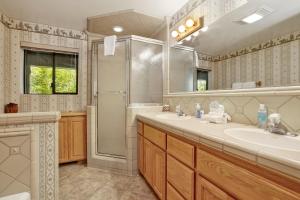 a bathroom with a shower and a sink and a tub at Eagle point lake house #2471 in Big Bear Lake
