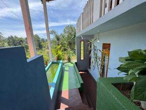 a house with a swimming pool in the yard at New Farmers Paradise in Ella