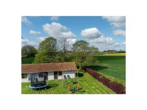 a small house in the middle of a field at 1-bedroom holiday apartment in Hasselberg