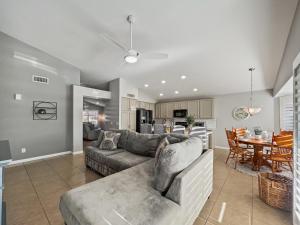 a living room with a couch and a dining room at Kimberly Surprise in Surprise