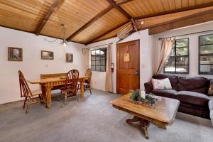 a living room with a table and a couch at Brown bears cabin #1091 in Big Bear Lake
