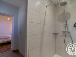 a shower with a glass door in a bathroom at Gîte spacieux de 8 chambres au cœur des vignes d'Anjou - FR-1-622-112 in Saint-Sulpice +27 photos