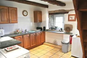 مطبخ أو مطبخ صغير في Mimosa Cottage