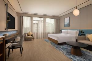 Postel nebo postele na pokoji v ubytování Hilton Garden Inn Chengdu Jinniu Yipintianxia