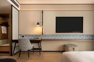 Postel nebo postele na pokoji v ubytování Hilton Garden Inn Chengdu Jinniu Yipintianxia