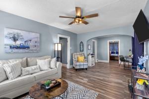 a living room with a couch and a ceiling fan at Sweet Cherry Escape | JZ Vacation Rentals in Warrenton