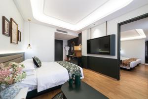 Letto o letti in una camera di Vishan Garden Boutique Hotel 厦门维尚花园潮宿 中山路步行街店