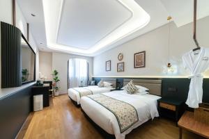 Letto o letti in una camera di Vishan Garden Boutique Hotel 厦门维尚花园潮宿 中山路步行街店