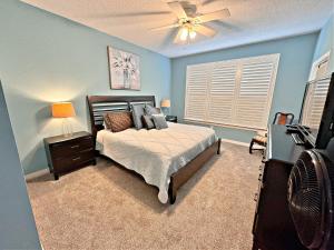 a bedroom with a bed and a ceiling fan at Sweet Tee at Cypress Point in Gulf Shores +25 photos