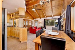a kitchen and living room with a table and chairs at Moulin rouge #2055 in Big Bear Lake