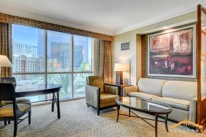 a living room with a couch and a table at MGM Signature-03-611 Strip View Jacuzzi Studio in Las Vegas