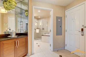 a large bathroom with a sink and a shower at MGM Signature-03-611 Strip View Jacuzzi Studio in Las Vegas