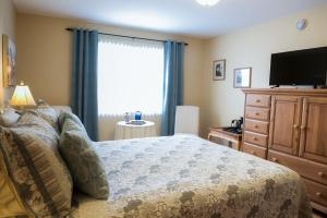 Cama o camas de una habitación en Serene Suites