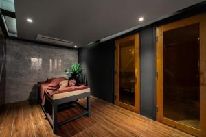 a woman laying in a bed in a room at Rest Hotel & Apartment in Danang +65 photos