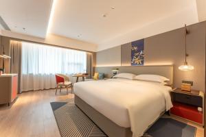 ECHENG Hotel, Jianghan Road Pedestrian Street, Wuhan River Beach客房内的一张或多张床位