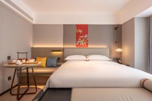 Ένα ή περισσότερα κρεβάτια σε δωμάτιο στο Yicheng Hotel, Jianghan Road Pedestrian Street, Wuhan River Beach +20 φωτογραφίες